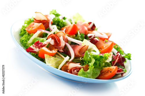 Smoked ham and vegetables on white background