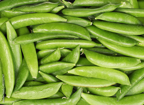 Fresh harvested green peas background