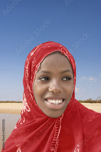 Young Afro beauty wearing a red headscarf photo