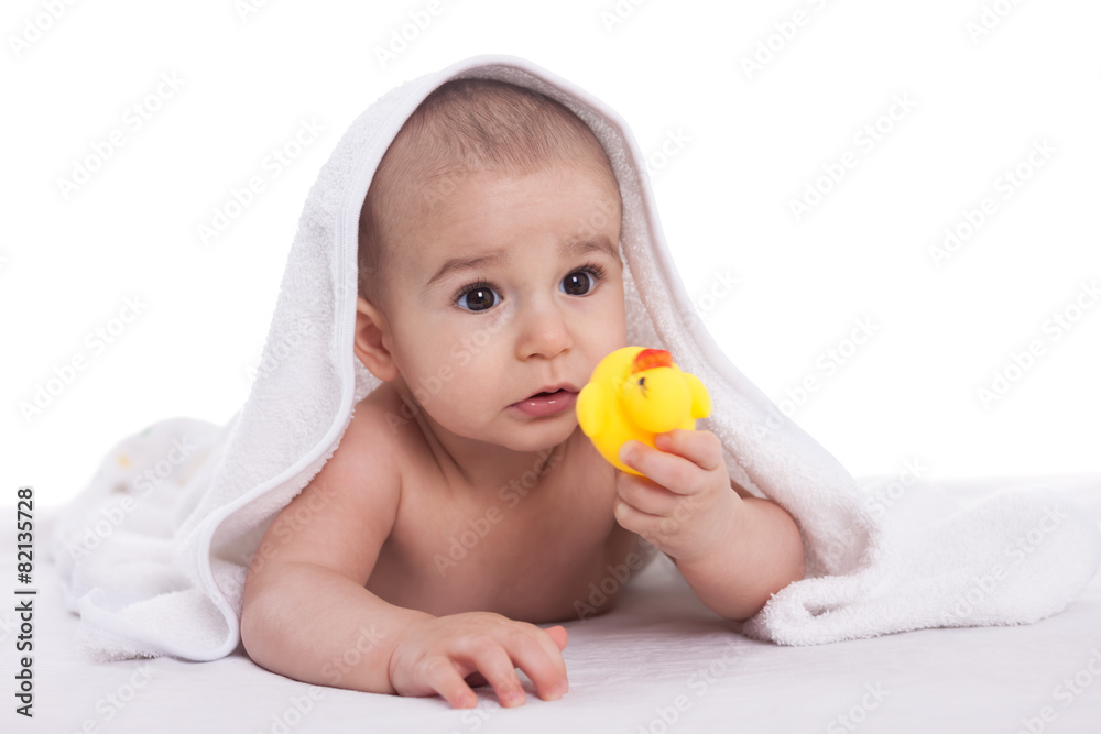 Baby with yellow duck isolated on white Baby with yellow duck isolated on white