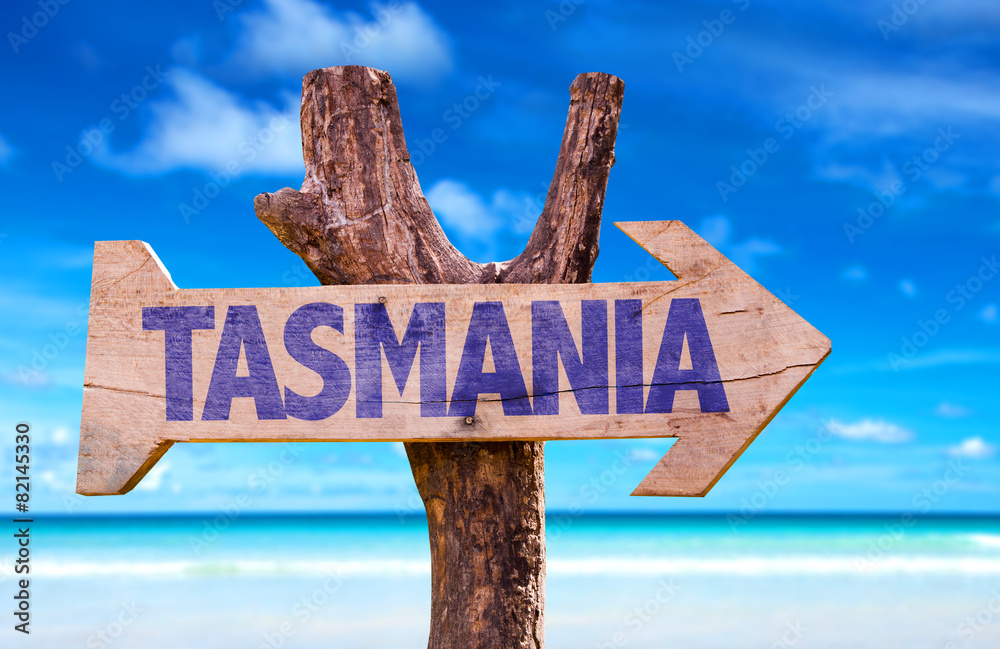 Tasmania wooden sign with beach background