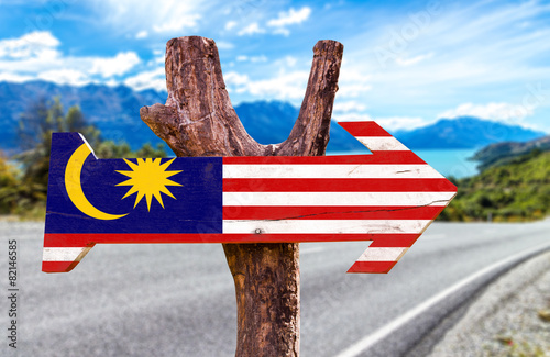 Malaysia Flag wooden sign with road background photo