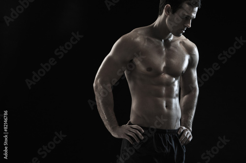 Bare chested Caucasian man with hands on hips