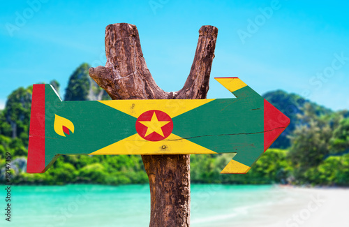 Grenada Flag wooden sign with beach background