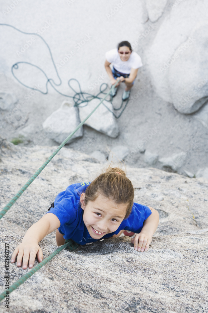 Asian mother and daughter rock climbing Asian mother and daughter rock climbing