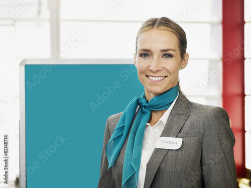 Caucasian hostess smiling