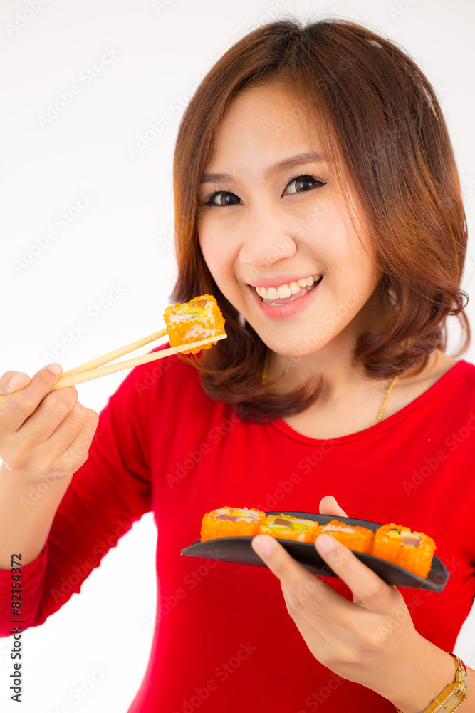 Close-up. young lady eating sushi roll Close-up. young lady eating sushi roll