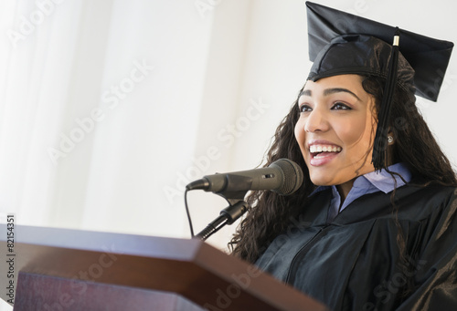 Hispanic student giving speech at graduation photo
