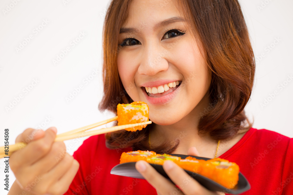Close-up. young lady eating sushi roll Close-up. young lady eating sushi roll