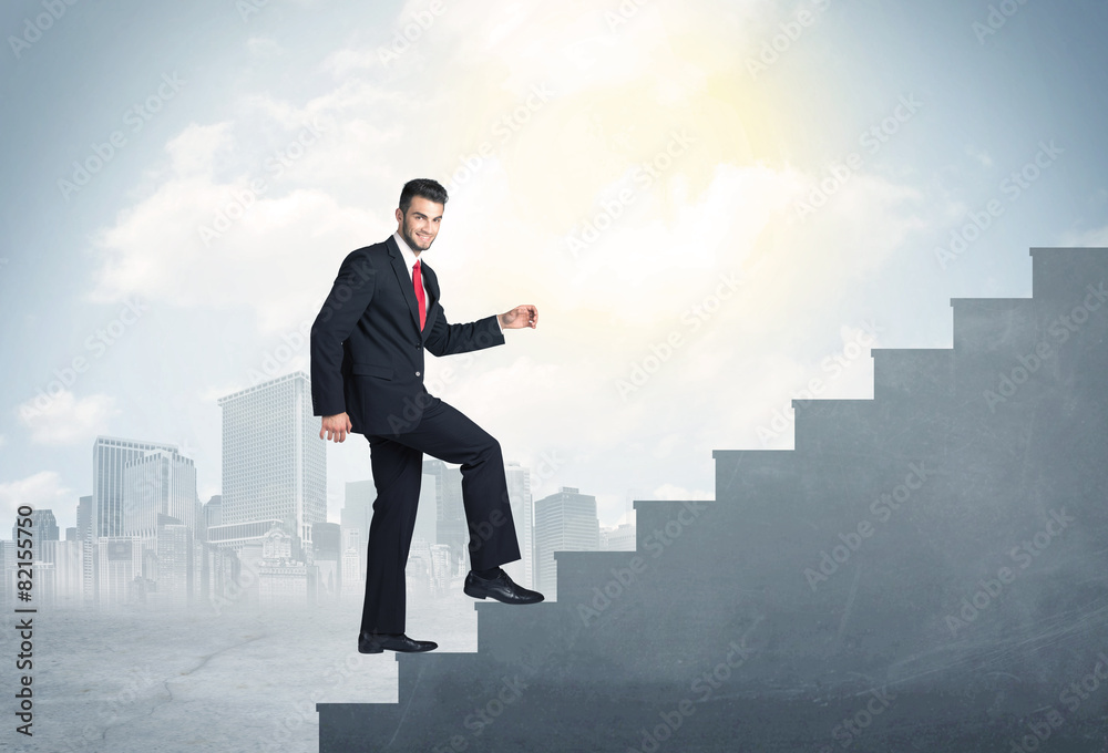 Businessman climbing up a concrete staircase concept Businessman climbing up a concrete staircase concept