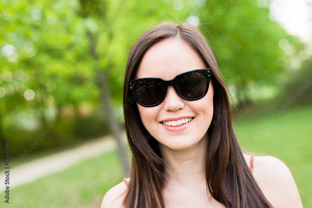Summer girl portrait. Asian woman smiling happy on sunny summer 
