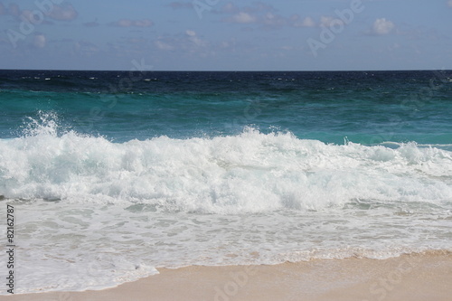 Wave breaking on pink beach