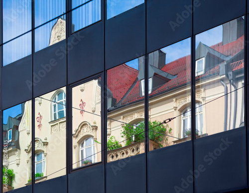 Old building architecture reflected in modern building