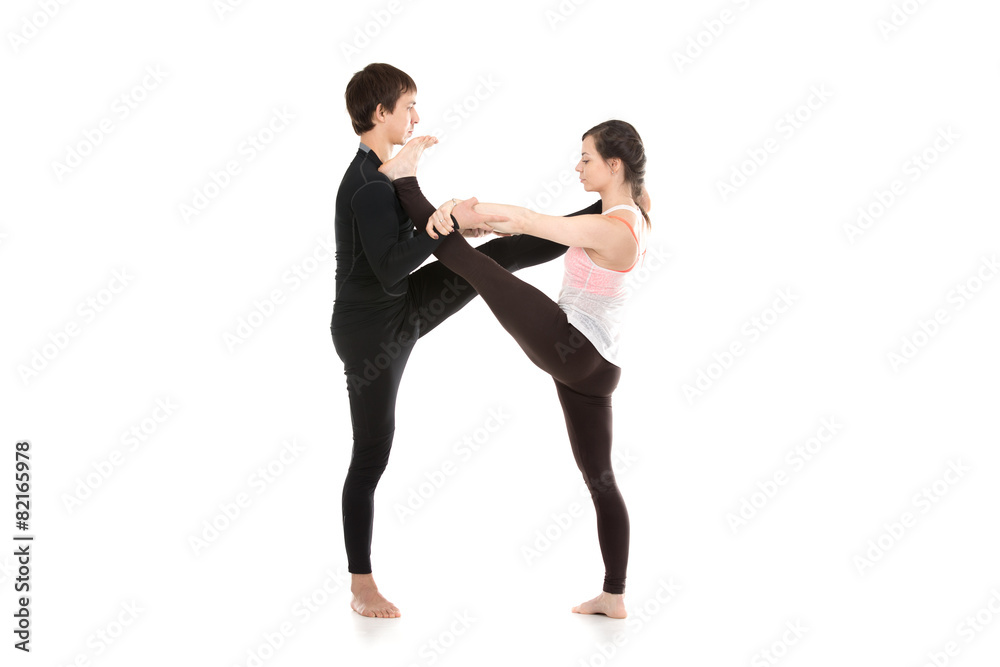 Acro yoga extended hand-to-big-toe pose