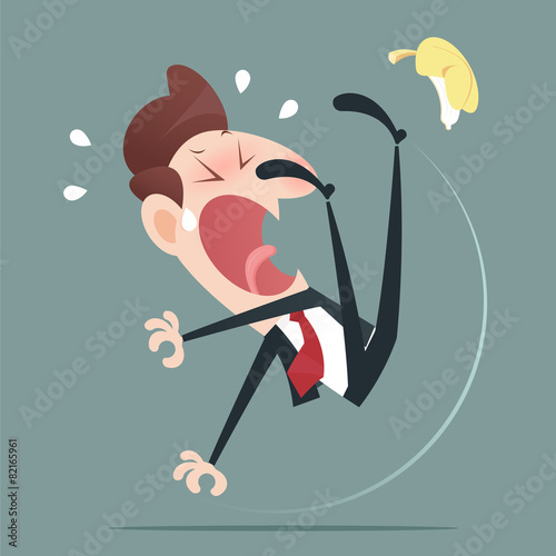 Businessman slipping and falling from a banana peel