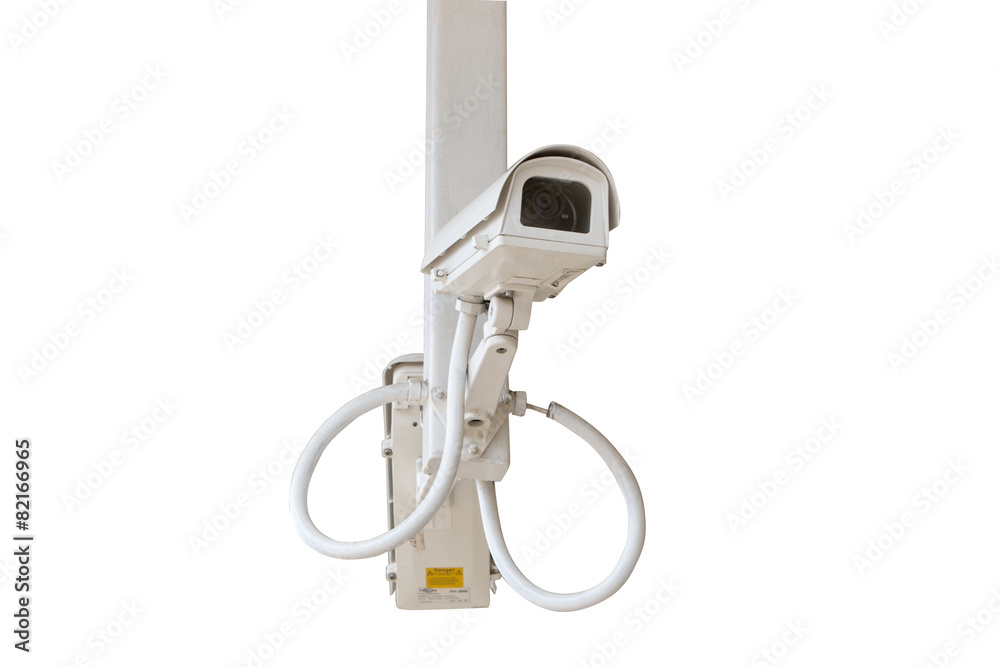 Security camera isolated on blue sky background.