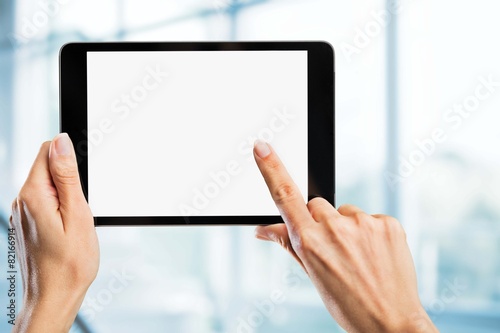 Black. Tablet computer isolated in a hand on the white