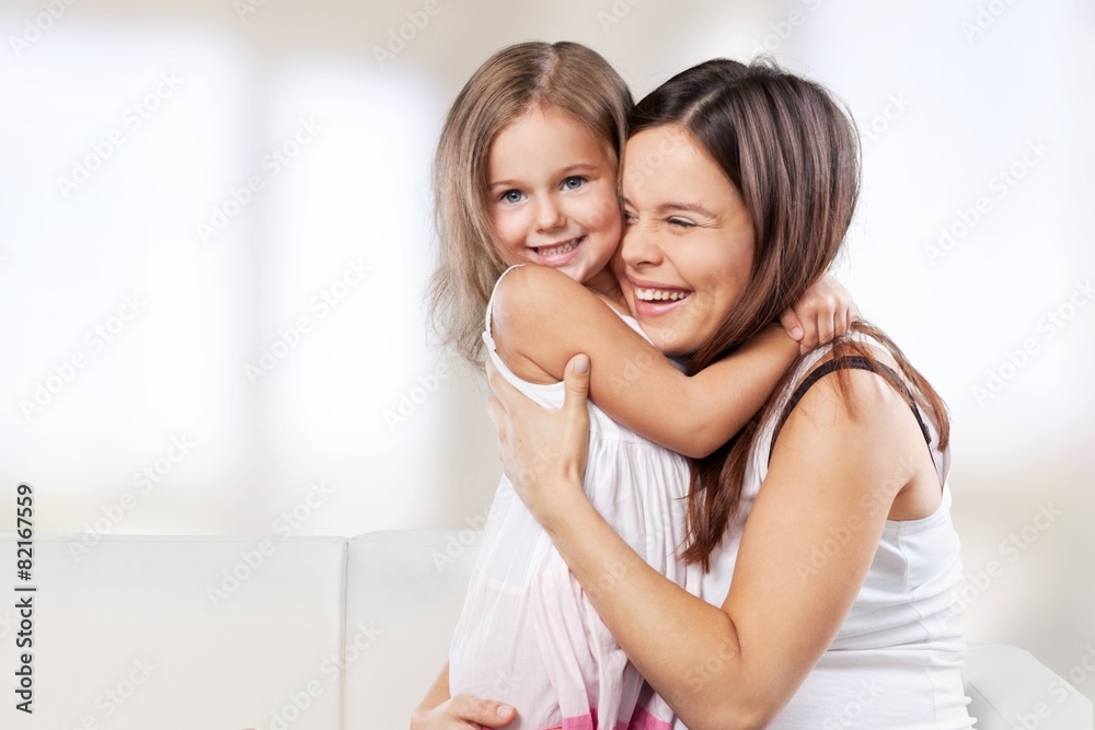 Adorable. Happy family. Mother and baby daughter plays, hugging Adorable. Happy family. Mother and baby daughter plays, hugging
