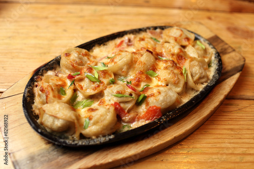Dumplings baked with bacon on a plate