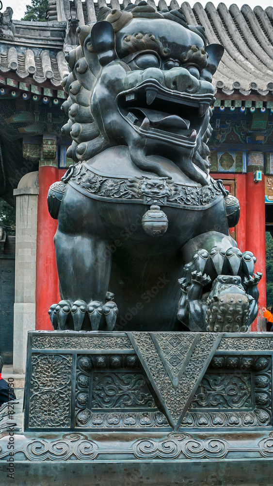 Bronze lion - dog guard at the entrance of Pavilion Goodwill and Bronze lion - dog guard at the entrance of Pavilion Goodwill and