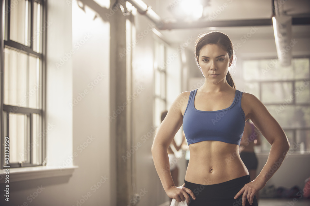 Woman standing in gym Woman standing in gym