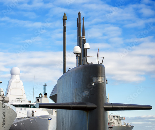 Tela Naval fleet. Submarine and warships with guns.