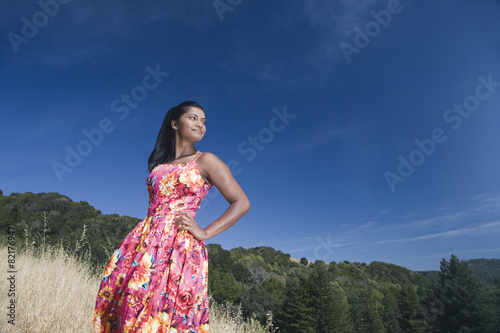 Mixed race woman in sundress in rural area