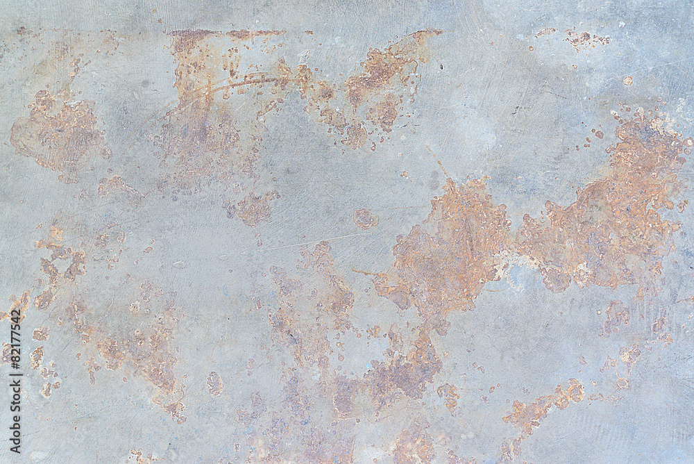 Brown rust stains on polished old grey concrete floor