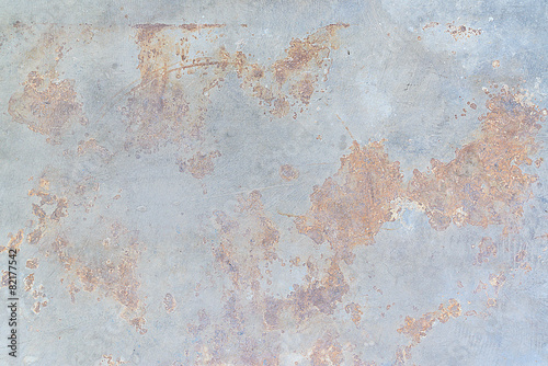 Brown rust stains on polished old grey concrete floor