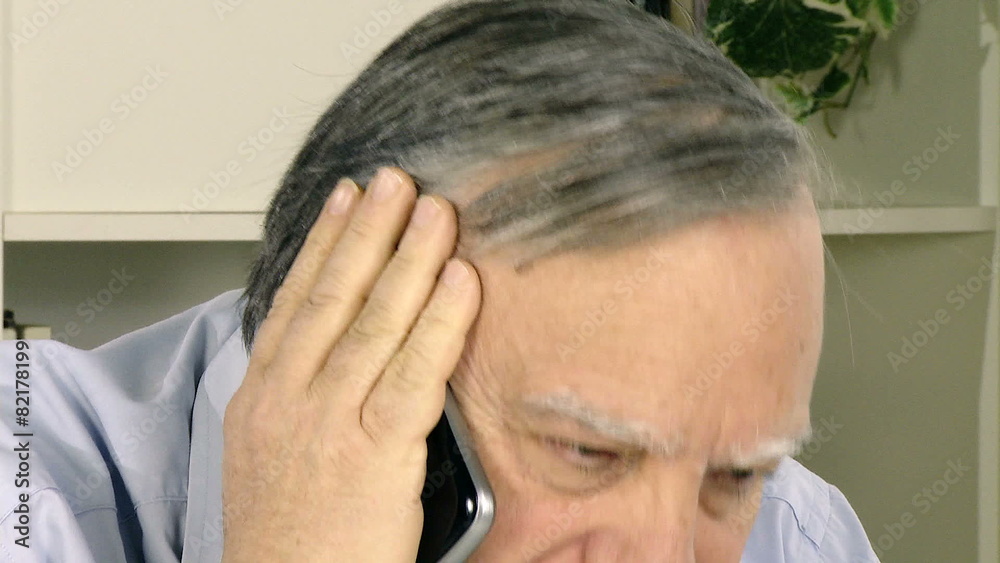 Stressed out senior business man on the phone closeup Stressed out senior business man on the phone closeup