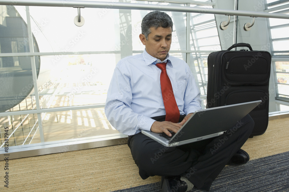 Hispanic businessman typing on laptop Hispanic businessman typing on laptop
