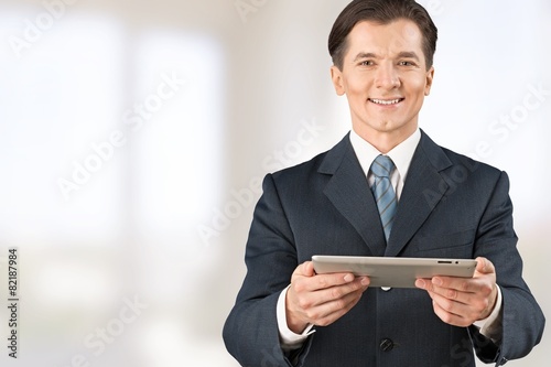 Wallpaper Mural Social. Businessman hold tablet with growth chart Torontodigital.ca