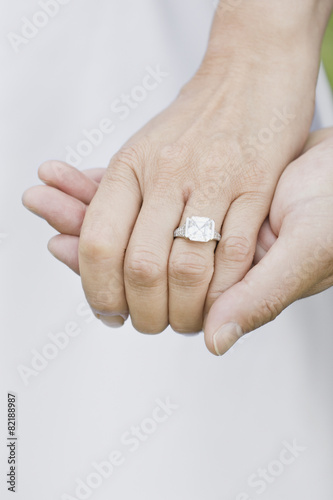 Close up of Asian woman's wedding ring photo