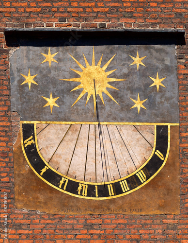 Detail of old sundial on church in old town in Gdansk, Poland.