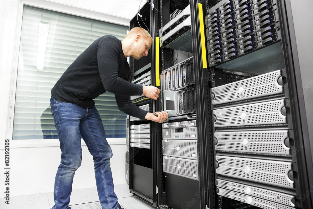 IT engineer installs blade server in datacenter IT engineer installs blade server in datacenter