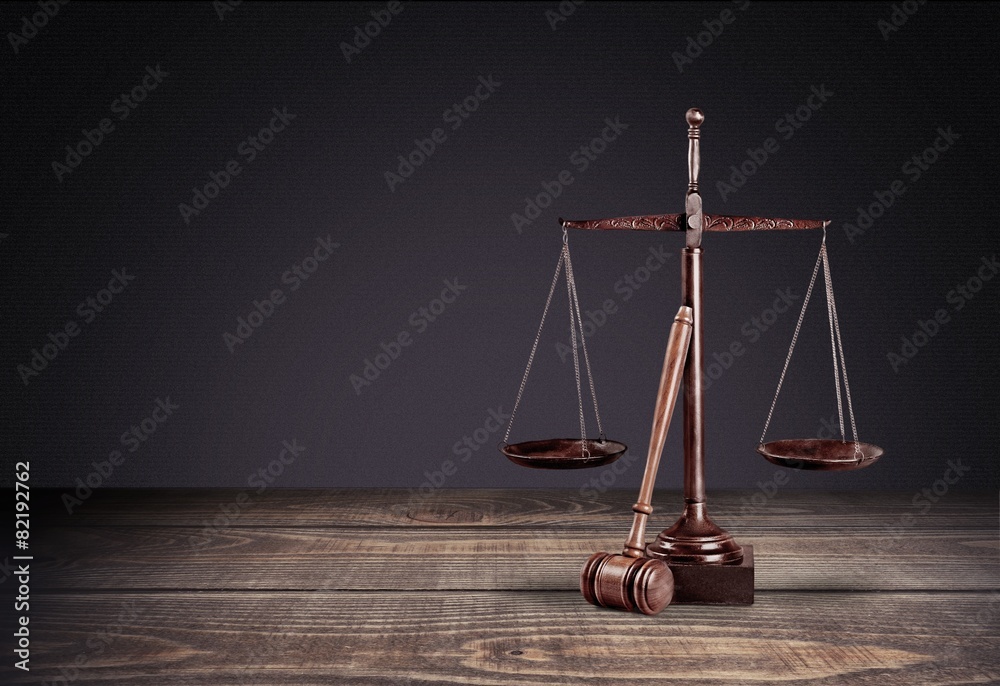 Lawyer. Law scales on table in front black background. Symbol of Lawyer. Law scales on table in front black background. Symbol of