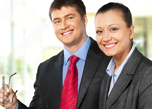 Business. Businesswoman smiling with a businessman