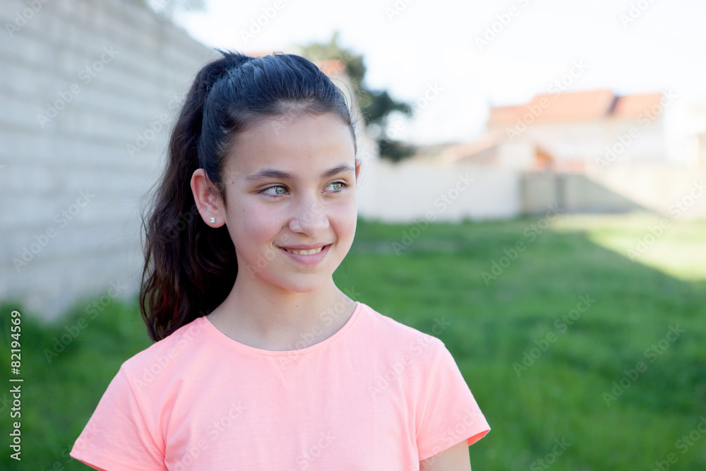 Preteen with blue eyes in the garden