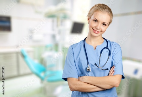 Nurse. Cheerful Young Nurse in Blue Scrubs