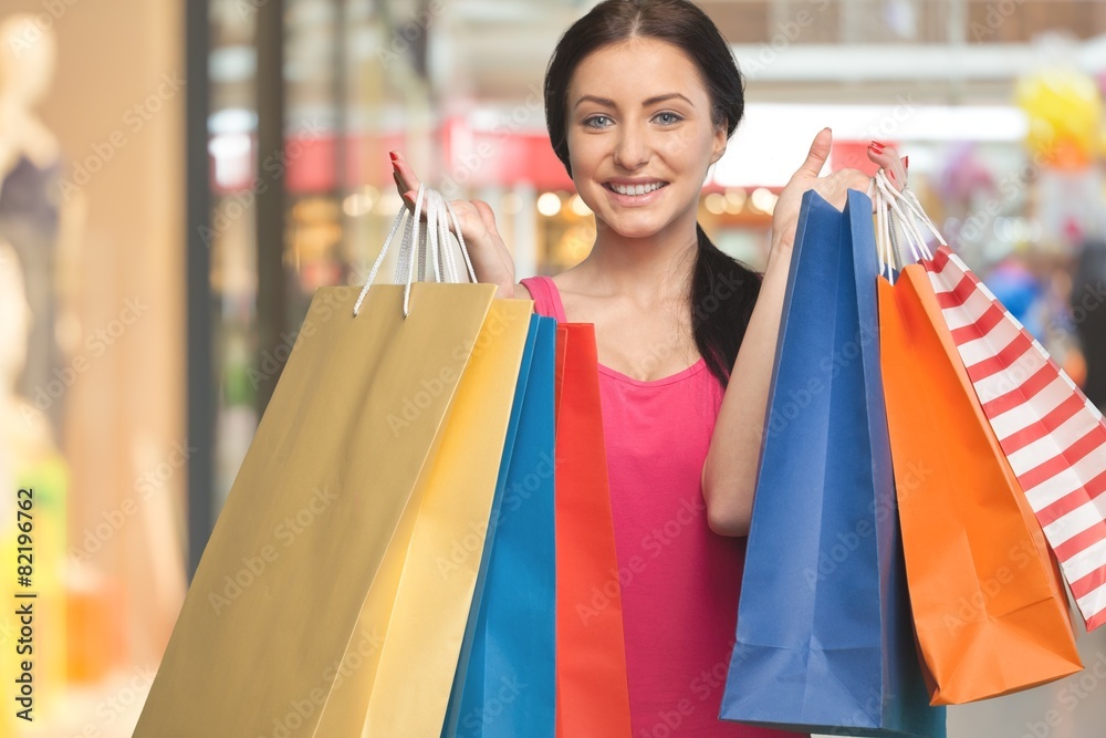 Shopping. Beautiful Brunette with Shopping Bags. Isolated. Shopping. Beautiful Brunette with Shopping Bags. Isolated.