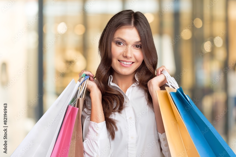 Summer. Shopping and tourism concept - woman with shopping bags Summer. Shopping and tourism concept - woman with shopping bags