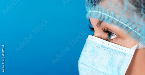 Professional doctor at work blue background
