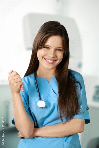 Free Download Nurse. Cheerful Young Nurse in Blue Scrubs - GFXLoad
