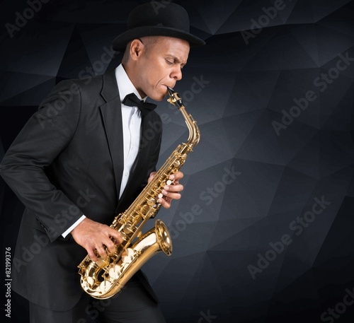 Canvas Print Sax. Black american jazz saxophone player. Vintage. Studio shot.