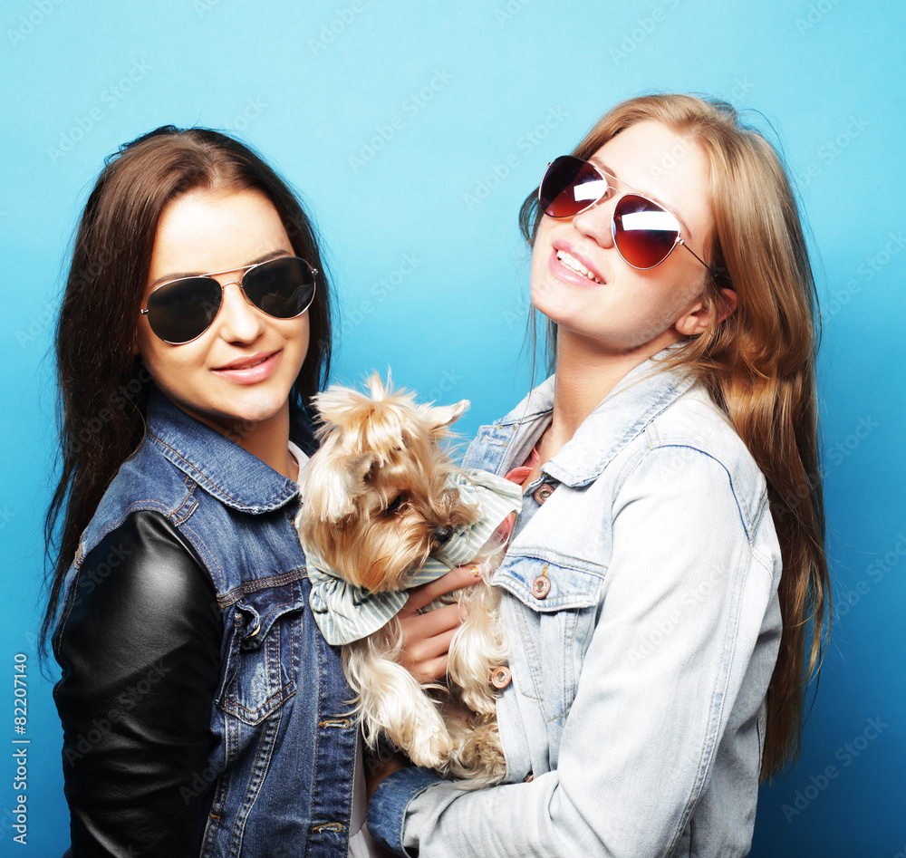 two teenage sisters with Yorkshire Terrier two teenage sisters with Yorkshire Terrier