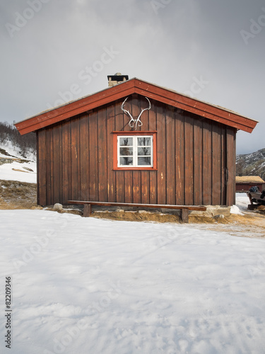 cabin with snow