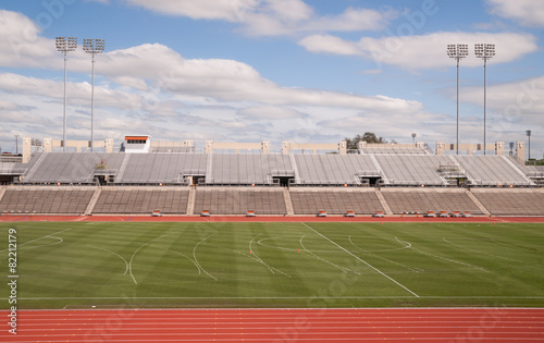 College Level Track Stadium Puffy Clouds Blue Sky photo