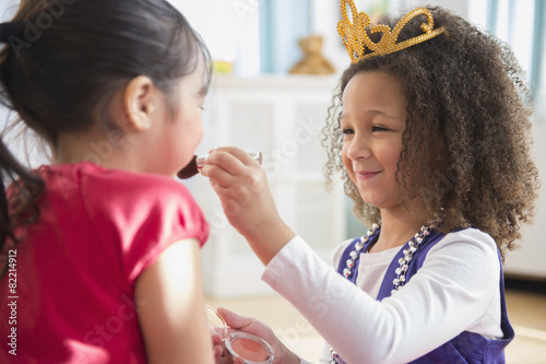 Girls playing dress up together