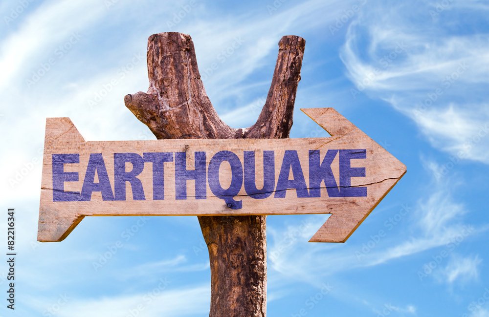 Earthquake wooden sign with sky background