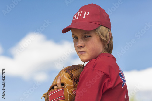 Caucasian boy playing baseball outdoors photo